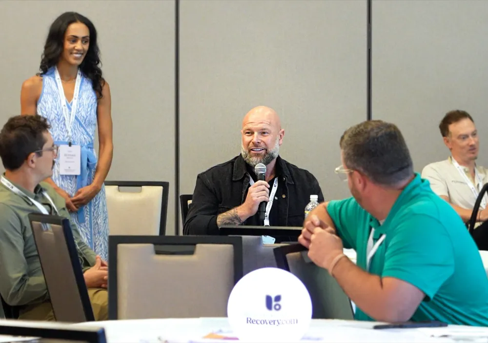 elev8 founder Gary speaking with attendees at a behavioral health conference